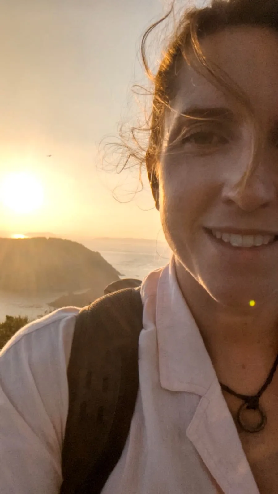 Lucy on the Guernsey coast at sunset